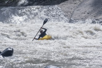 Young woman kayaking in river, Costa Rica, Central America