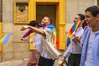 Group of diverse young people actively participating in a pride parade, expressing joy and holding