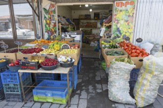 A colourful fruit and vegetable stall with crates and price tags, Martuni, Gegharkunik province,