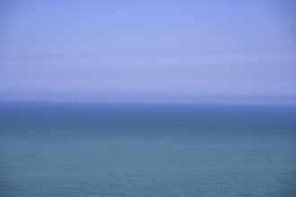 Wind turbines on the sea, hike from Yport to Etretat along the chalk cliff coast, Seine-Maritime