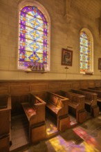 Colourful stained glass windows in the church of Saint Martin, Yport, Département Seine-Maritime,