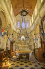 Church of Saint Martin decorated with flags and fishing nets, Yport, Département Seine-Maritime,