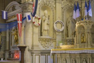 Flags and lifebuoys in the church of Saint Martin, Yport, Département Seine-Maritime, France