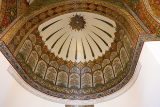Decorated ceiling with bright patterns and artistic elements in bold colours, Inside the historic,