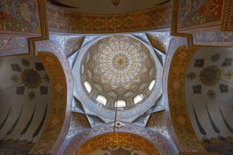 Detailed dome-shaped ceiling painting with elaborate ornaments and warm colours, Inside the