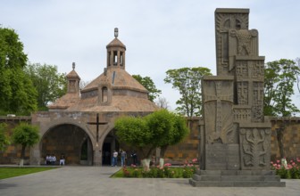 Historic church with characteristic architecture surrounded by manicured gardens and flowers, St