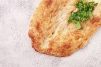 Georgian lavash bread, freshly baked, top view, on the table, no people