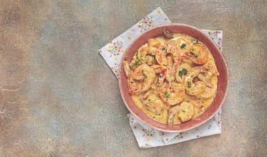 Shrimp in creamy garlic sauce, with spices and herbs
