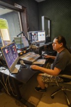 Porcupine, South Dakota - Lucian Little White Man broadcasts on KILI Radio, the voice of the Lakota