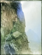 Climber on rocks, Cuillin mountains, Skye, Scotland, UK c 1900-1920 colourised image