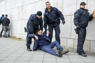 Police arrest activists of the New Generation during an attempt at a performance by the New