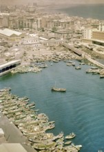 View from cable car of boats and buildings in fishing port, Barceloneta area of Barcelona, Spain,