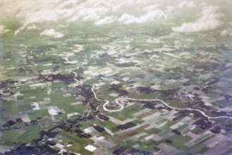 Captioned as 'aerial photo Saigon', meandering river in flat agricultural landscape of paddy