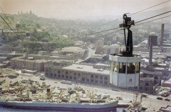 Cable car over port docks and city centre of Barcelona, Spain, Europe 1965
