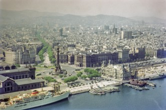 View from cable car to Columbus Monument, Plaça Portal de la Pau, city centre of Barcelona, Spain,