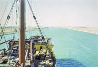 Shipping passing through the Suez Canal photographed onboard a cargo ship, Egypt, norther Africa