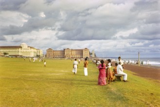 People enjoying leisure activities by the ocean, Galle Face Green, Colombo, Sri Lanka, South Asia,