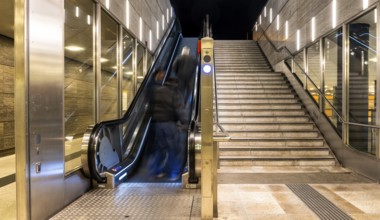 Night photo, long exposure with motion blur, modern underground entrance at Unter den Linden
