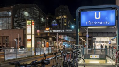 Night photo, long exposure at Friedrichstraße S-Bahn and metro station, in the centre runs the tram