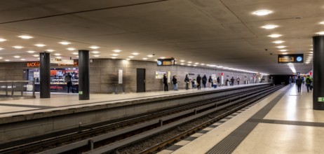 Night photo, long exposure with motion blur, platform at Unter den Linden station, contemporary and