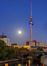 View from the Monbijou Bridge to the television tower, evening light with full moon on the skyline,