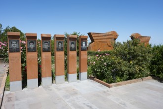 Memorial with portraits of soldiers, surrounded by nature and flowers, Sardarapat Monument, Araks