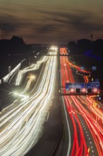 Motorway near Stuttgart with several lanes in the evening with sunset. Heavy traffic with light