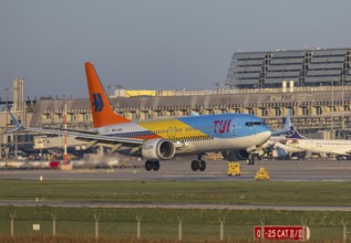 Flight operations at Stuttgart Airport with terminal. Aircraft on landing. Aircraft registration