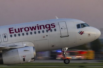 Stuttgart Airport in the early morning. Eurowings aircraft taking off. Close-up. Motion blur.