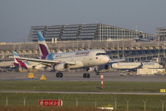 Flight operations at Stuttgart Airport with terminal. Aircraft on landing. Aircraft registration