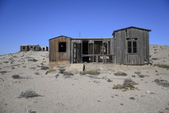 Dilapidated building in the desert sand, Pomona, restricted diamond area, near Lüderitz, Karas