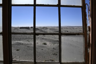 View from a dilapidated building into the desert, Pomona, restricted diamond area, near Lüderitz,