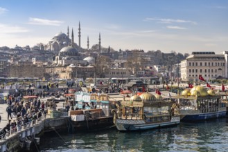 Restaurant boats on the banks of Eminönü, Rüstem Pasha Mosque and Suleymaniye Mosque, Istanbul,