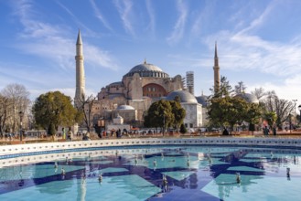 Fountain in Sultan Ahmet Park and the present-day mosque Hagia Sophia or Church of St Sophia,