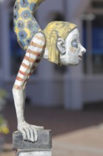 Sculpture Die Literaturnerin by Hans Scheib 2007, Modern Art, Girl figure doing a handstand on a