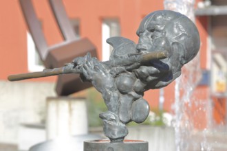 Sculpture Flute Player by Karel Fron 2008, bronze sculpture, modern art, bizarre head with flute,