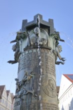 Town hall fountain by Klaus Ringwald 1998, bronze sculptures, reliefs, figures and text on the