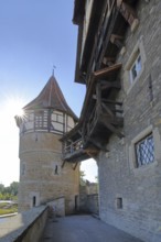Water tower with outside staircase built around 1255 in backlight, wooden bridge, Zollernschloss,