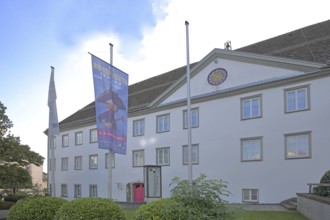 Old Castle and Hohenzollern State Museum built in 1705, flags, banners, Hechingen, Swabian Alb,