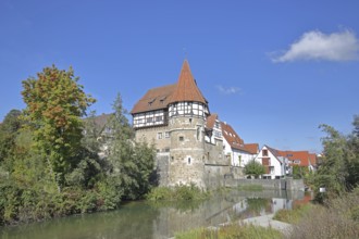 Zollern Castle built around 1255 with water tower on the Eybach stream, half-timbered house,
