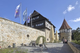 Water tower of the medieval Zollern castle built around 1255, half-timbered house, flags, stone