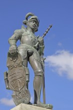 Medieval knight figure with Württemberg coat of arms shield and sword, bronze sculpture, knight's