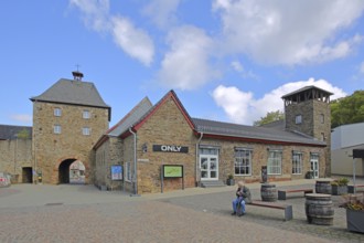 Historic Orchheim Tor, town gate, town tower, town fortification, town wall, person sitting on a