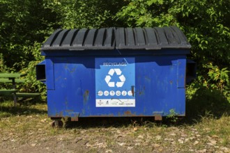 Blue metal with black plastic lids industrial size recycling bin for depositing glass, metal and