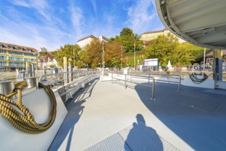 Open ship deck with a view of the shore landscape and autumn weather, Meersburg, Lake Constance,