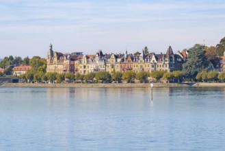 Victorian-inspired buildings along the promenade on a lake under a clear sky, Constance, Lake
