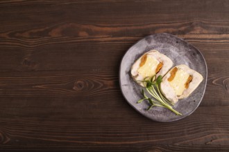 Chicken, egg and dried apricot meatloaf, microgreen on brown wooden. Diet, healthy eating. top