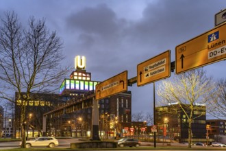 Traffic signs at Wallring and Dortmund's landmark U, Centre for Art and Creativity at dusk,