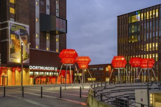 Illuminated sculptures of Dortmund roses in front of Dortmund's landmark U, Centre for Art and