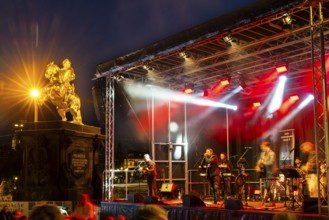 Equestrian statue of Augustus the Strong next to stage with musicians, Blue Hour, Neustadt,